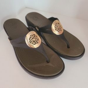 Crocs Brown Flip Flops with gold accent